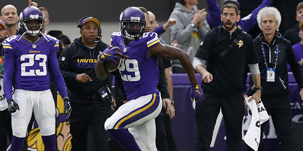 Minnesota Vikings cornerback Xavier Rhodes returns an interception 100-yards for a touchdown during...