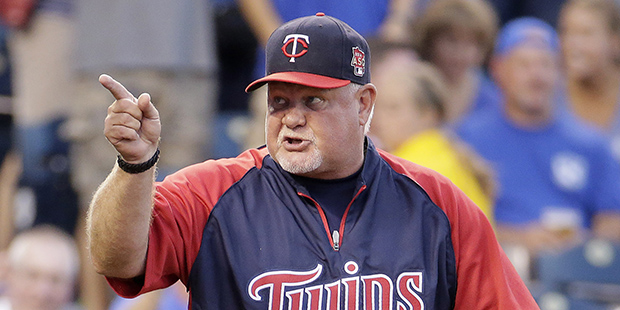 Minnesota Twins manager Ron Gardenhire talks to home plate umpire Ted Barrett after being ejected f...