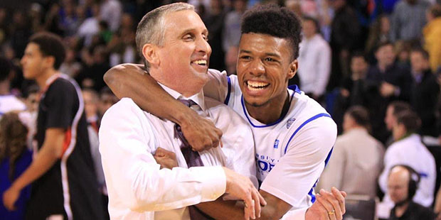 Point guard Shannon Evans embraces coach Bobby Hurley during a game at the Univeristy at Buffalo. (...