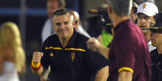 FILE - In this Oct. 3, 2015, file photo, Arizona State head coach Todd Graham, left, celebrates wit...