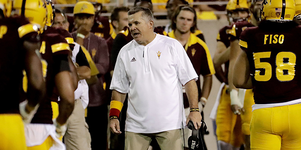 Arizona State coach Todd Graham talks to his players during the second half of an NCAA college foot...