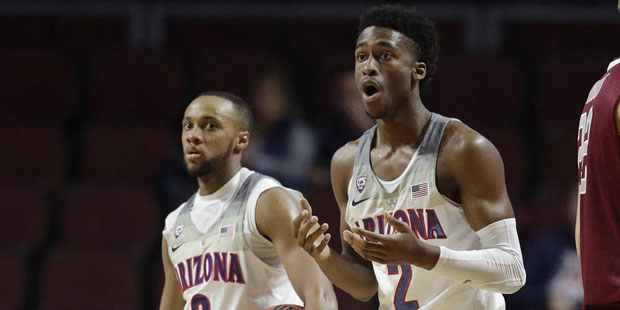 Arizona's Kobi Simmons reacts after he was called for a foul against Santa Clara during the first h...
