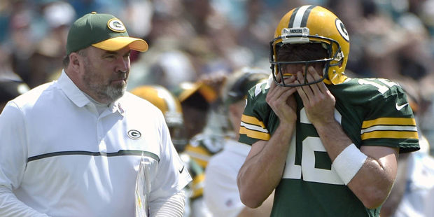 FILE - In this Sept. 11, 2016, file photo, Green Bay Packers head coach Mike McCarthy and quarterba...