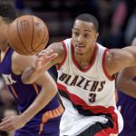 Portland Trail Blazers guard C.J. McCollum chases a loose ball during the first half of the team's NBA basketball game against the Phoenix Suns in Portland, Ore., Tuesday, Nov. 8, 2016. (AP Photo/Craig Mitchelldyer)