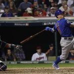 Chicago Cubs' Javier Baez hits a home run during the fifth inning of Game 7 of the Major League Baseball World Series against the Cleveland Indians Wednesday, Nov. 2, 2016, in Cleveland. (AP Photo/David J. Phillip)