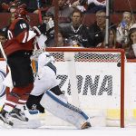 Arizona Coyotes left wing Anthony Duclair (10) creates a screen as San Jose Sharks goalie Martin Jones, right, gives up a goal to Coyotes left wing Jamie McGinn during the second period of an NHL hockey game Tuesday, Nov. 1, 2016, in Glendale, Ariz. (AP Photo/Ross D. Franklin)