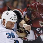 San Jose Sharks center Micheal Haley (38) gets into a fight with Arizona Coyotes center Ryan White (25) during the first period of an NHL hockey game Tuesday, Nov. 1, 2016, in Glendale, Ariz. (AP Photo/Ross D. Franklin)