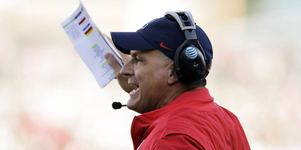 Arizona head coach Rich Rodriguez directs his team during the first half of an NCAA college footbal...