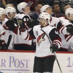 Arizona Coyotes left wing Jordan Martinook, front, is congratulated after scoring a goal as he skates past the bench during the first period of an NHL hockey game against the Colorado Avalanche, Tuesday, Nov. 8, 2016, in Denver. (AP Photo/David Zalubowski)
