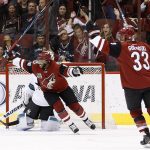 Arizona Coyotes left wing Anthony Duclair (10) and defenseman Alex Goligoski (33) celebrate a goal by Jamie McGinn against the San Jose Sharks during the second period of an NHL hockey game Tuesday, Nov. 1, 2016, in Glendale, Ariz. (AP Photo/Ross D. Franklin)
