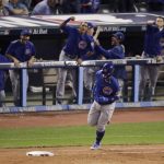 Chicago Cubs' Javier Baez rounds the bases after a home run against the Cleveland Indians during the fifth inning of Game 7 of the Major League Baseball World Series Wednesday, Nov. 2, 2016, in Cleveland. (AP Photo/Charlie Riedel)