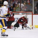 Arizona Coyotes goalie Louis Domingue (35) looks back at the net after giving up a goal to Nashville Predators right wing Craig Smith as Predators' Mike Ribeiro, left, watches during the second period of an NHL hockey game Thursday, Nov. 3, 2016, in Glendale, Ariz. (AP Photo/Ross D. Franklin)
