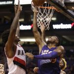 Phoenix Suns guard Leandro Barbosa (19) shoots in front of Portland Trail Blazers forward Al-Farouq Aminu during the second half of an NBA basketball game, Wednesday, Nov. 2, 2016, in Phoenix. Phoenix defeated Portland 118-115 in overtime. (AP Photo/Rick Scuteri)