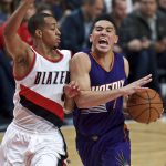 Phoenix Suns guard Devin Booker, right, drives to the basket past Portland Trail Blazers guard C.J. McCollum during the second half of an NBA basketball game in Portland, Ore., Tuesday, Nov. 8, 2016. (AP Photo/Craig Mitchelldyer)