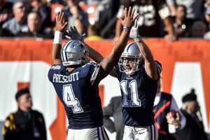 Dallas Cowboys wide receiver Cole Beasley (11) celebrates his touchdown with quarterback Dak Prescott (4) in the first half of an NFL football game against the Cleveland Browns, Sunday, Nov. 6, 2016, in Cleveland. (AP Photo/David Richard)