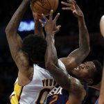 Phoenix Suns guard Eric Bledsoe, right, competes for the ball with Los Angeles Lakers guard Nick Young, left, during the first half of an NBA basketball game in Los Angeles, Sunday, Nov. 6, 2016. (AP Photo/Alex Gallardo)