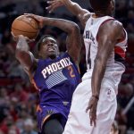 Phoenix Suns guard Eric Bledsoe, left, shoots over Portland Trail Blazers forward Maurice Harkless during the second half of an NBA basketball game in Portland, Ore., Tuesday, Nov. 8, 2016. The Trail Blazers won 124-121. (AP Photo/Craig Mitchelldyer)