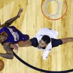 New Orleans Pelicans forward Anthony Davis, right, blocks a shot by Phoenix Suns guard Eric Bledsoe during the first half of an NBA basketball game in New Orleans, Friday, Nov. 4, 2016. (AP Photo/Gerald Herbert)