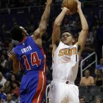 Phoenix Suns guard Devin Booker (1) shoots as Detroit Pistons guard Ish Smith defends during the third quarter of an NBA basketball game Wednesday, Nov. 9, 2016, in Phoenix. The Suns defeated the Pistons 107-100. (AP Photo/Rick Scuteri)