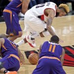 Portland Trail Blazers guard Allen Crabbe, middle, gathers a loose ball in front of Phoenix Suns forward Jared Dudley, back left, during the second half of an NBA basketball game in Portland, Ore., Tuesday, Nov. 8, 2016. Suns' Brandon Knight is at lower right. (AP Photo/Craig Mitchelldyer)