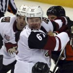 Arizona Coyotes' Jordan Martinook (48) and Lawson Crouse (67) fight with Anaheim Ducks' Kevin Bleksa (2) during the second period of an NHL hockey game in Anaheim, Calif., Friday, Nov. 4, 2016. (AP Photo/Reed Saxon)
