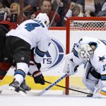 San Jose Sharks goalie Martin Jones (31) makes a save on a shot by Arizona Coyotes right wing Shane Doan, left, as Sharks' defenseman Brenden Dillon (4) arrives to defend during the first period of an NHL hockey game Tuesday, Nov. 1, 2016, in Glendale, Ariz. (AP Photo/Ross D. Franklin)