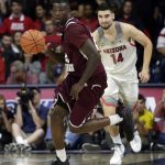 Texas Southern forward Derrick Griffin brings the ball up in front of Arizona center Dusan Ristic (14) during the first half of an NCAA college basketball game, Wednesday, Nov. 30, 2016, in Tucson, Ariz. (AP Photo/Rick Scuteri)