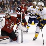 Arizona Coyotes goalie Louis Domingue, left, gives up a goal to Nashville Predators defenseman Matt Irwin as Predators' left wing Colin Wilson (33) and center Mike Ribeiro (63) look on along with Coyotes' defenseman Oliver Ekman-Larsson (23) during the first period of an NHL hockey game Thursday, Nov. 3, 2016, in Glendale, Ariz. (AP Photo/Ross D. Franklin)