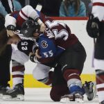 Arizona Coyotes center Ryan White, left, fights with Colorado Avalanche left wing Cody McLeod in the first period of an NHL hockey game Tuesday, Nov. 8, 2016, in Denver. (AP Photo/David Zalubowski)