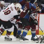Arizona Coyotes right wing Shane Doan, left, fights or control of the puck with Colorado Avalanche left wing Gabriel Landeskog, of Sweden, in the first period of an NHL hockey game Tuesday, Nov. 8, 2016, in Denver. (AP Photo/David Zalubowski)