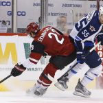 Winnipeg Jets center Mark Scheifele (55) collides with Arizona Coyotes defenseman Oliver Ekman-Larsson (23) as they battle for the puck during the second period of an NHL hockey game Thursday, Nov. 10, 2016, in Glendale, Ariz. (AP Photo/Ross D. Franklin)