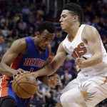 Detroit Pistons guard Ish Smith, left, drives on Phoenix Suns guard Devin Booker during the first quarter of an NBA basketball game, Wednesday, Nov. 9, 2016, in Phoenix. (AP Photo/Rick Scuteri)