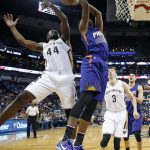 Phoenix Suns forward Marquese Chriss and New Orleans Pelicans forward Solomon Hill (44) reach for the ball under the basket during the first half of an NBA basketball game in New Orleans, Friday, Nov. 4, 2016. (AP Photo/Gerald Herbert)