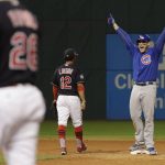 Chicago Cubs' Anthony Rizzo reacts after teammate Kris Bryant scored on Rizzo's hit during the fifth inning of Game 7 of the Major League Baseball World Series against the Cleveland Indians Wednesday, Nov. 2, 2016, in Cleveland. (AP Photo/David J. Phillip)