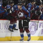 Colorado Avalanche center Nathan MacKinnon, front, is congratulated by teammates as he skates past the bench after scoring a goal against the Arizona Coyotes in the second period of an NHL hockey game Tuesday, Nov. 8, 2016, in Denver. (AP Photo/David Zalubowski)