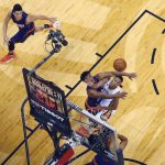 New Orleans Pelicans guard Tim Frazier goes to the basket against Phoenix Suns guard Eric Bledsoe during the first half of an NBA basketball game in New Orleans, Friday, Nov. 4, 2016. (AP Photo/Gerald Herbert)