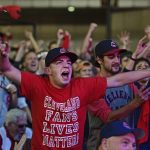 Cleveland Indians fan Zach Young gestures during a watch party for Game 7 of the baseball World Series between the Indians and the Chicago Cubs, outside Progressive Field, Wednesday, Nov. 2, 2016, in Cleveland. (AP Photo/David Dermer)