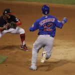 Chicago Cubs' Kyle Schwarber is out at second as Cleveland Indians' Francisco Lindor takes the throw during the third inning of Game 7 of the Major League Baseball World Series Wednesday, Nov. 2, 2016, in Cleveland. Schwarber tried to stretch a single into a double. (AP Photo/Gene J. Puskar)