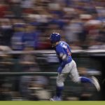Chicago Cubs' Javier Baez rounds the bases after a home run against the Cleveland Indians during the fifth inning of Game 7 of the Major League Baseball World Series Wednesday, Nov. 2, 2016, in Cleveland. (AP Photo/Matt Slocum)