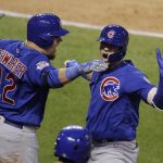 Chicago Cubs' Javier Baez celebrates his home run with Kyle Schwarber during the fifth inning of Game 7 of the Major League Baseball World Series against the Cleveland Indians Wednesday, Nov. 2, 2016, in Cleveland. (AP Photo/Gene J. Puskar)
