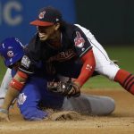 Cleveland Indians' Francisco Lindor gets tangled with Chicago Cubs' Anthony Rizzo as he breaks up a double play during the fourth inning of Game 7 of the Major League Baseball World Series Wednesday, Nov. 2, 2016, in Cleveland. (AP Photo/David J. Phillip)