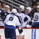 Winnipeg Jets center Andrew Copp (9) celebrates his goal against the Arizona Coyotes with Marko Dano, left, Paul Postma (4), Josh Morrissey (44) and Ben Chiarot, right, during the first period of an NHL hockey game Thursday, Nov. 10, 2016, in Glendale, Ariz. (AP Photo/Ross D. Franklin)