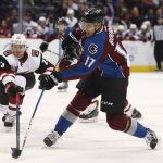 Colorado Avalanche right wing Rene Bourque, front, takes a shot as Arizona Coyotes defenseman Oliver Ekman-Larsson, of Sweden, defends in the first period of an NHL hockey game Tuesday, Nov. 8, 2016, in Denver. (AP Photo/David Zalubowski)