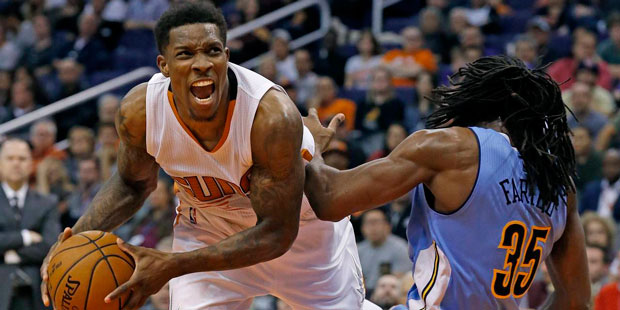 Phoenix Suns point guard Eric Bledsoe defended by Denver Nuggets' Kenneth Faried. (Associated Press...