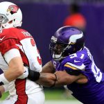 Carson Palmer is grabbed by Minnesota Vikings DE Everson Griffen in the Arizona Cardinals' loss on Nov. 20, 2016. (Associated Press)