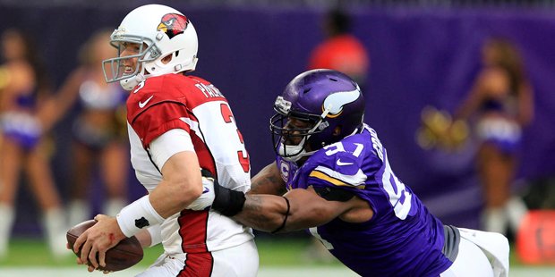 Carson Palmer is grabbed by Minnesota Vikings DE Everson Griffen in the Arizona Cardinals' loss on ...