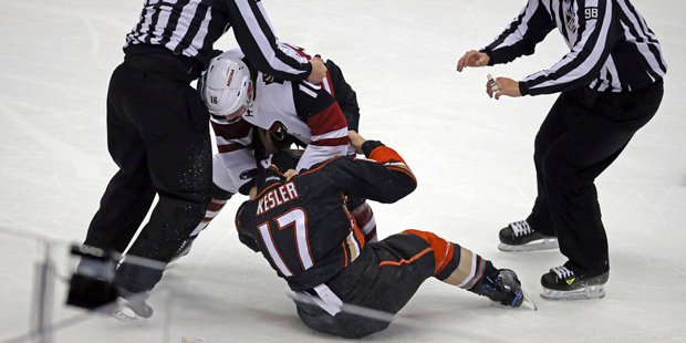 Arizona Coyotes left winger Max Domi (16) and Anaheim Ducks center Ryan Kesler (17) fight during th...