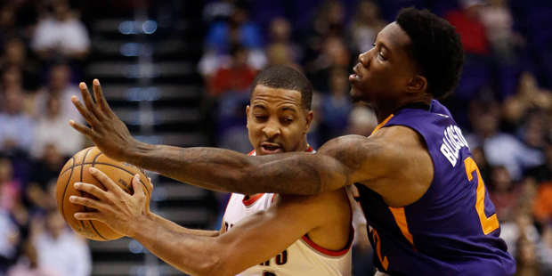 Portland Trail Blazers guard C.J. McCollum (3) gets pressured by Phoenix Suns guard Eric Bledsoe du...