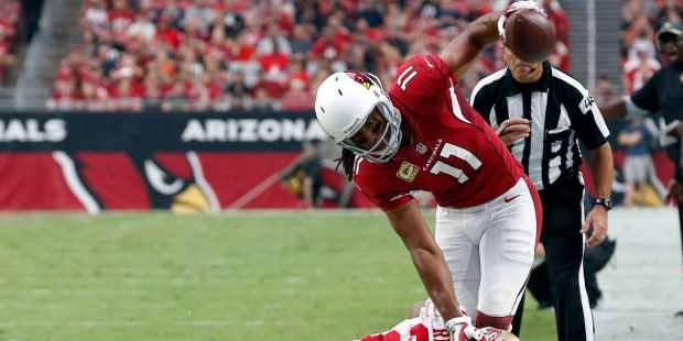 Arizona Cardinals wide receiver Larry Fitzgerald (11) is knocked out of bounds by San Francisco 49e...