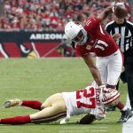 Arizona Cardinals wide receiver Larry Fitzgerald (11) is knocked out of bounds by San Francisco 49ers cornerback Keith Reaser (27) during the first half of an NFL football game, Sunday, Nov. 13, 2016, in Glendale, Ariz. (AP Photo/Ross D. Franklin)